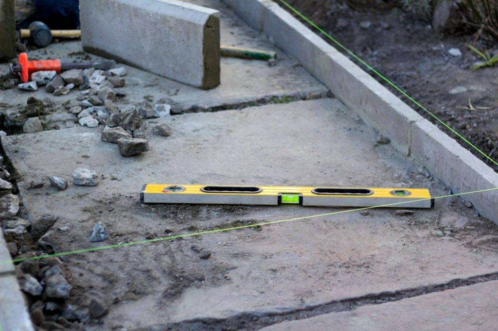 level tool. Construction industry. Yellow level tool spirit and green fishing line. Bricklayer and p