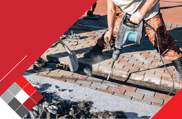 Pitfalls of Poor Paving Installation cover image of constructions worker laying paving